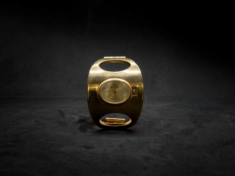Bracciale vintage rigido dorato con orologio Boucher